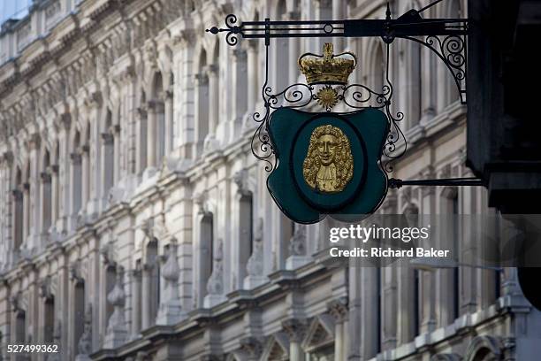 Detail of a City of London Goldsmith's ornate street sign on the corner of Suffolk Lane and Lombard Street in the heart of the capital's financial...