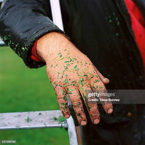 Head gardener Andrew Meadowcroft takes a break after trimming the topiary hedges at Newburgh Priory in Coxwold, North Yorkshire, UK. The English Yew...