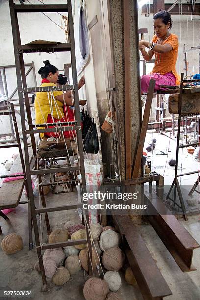 Weavers at Amity Carpent Factory. Amity Factory does not employ children and is a licensee of the GoodWeave Foundation and their carpets carry the...