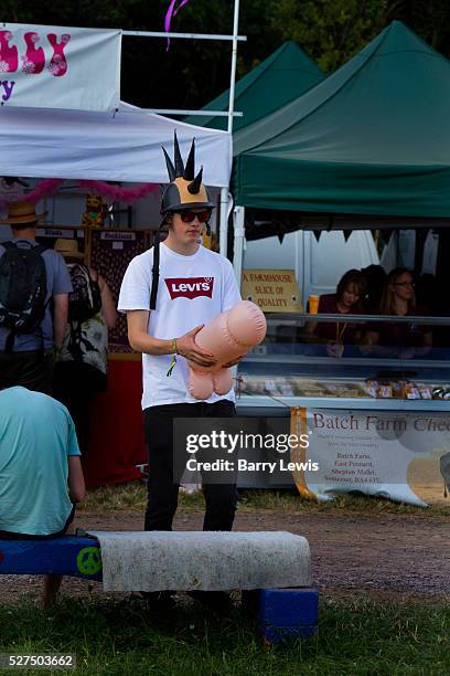 Boy with inflated penis, Glastonbury Festival. Glastonbury Festival is the largest greenfield festival in the world, and is now attended by around...