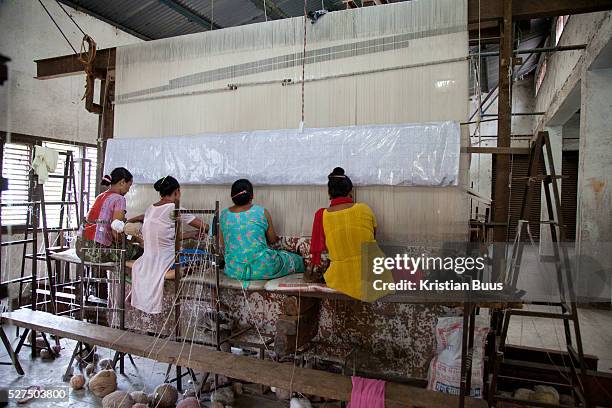 Weavers at Amity Carpent Factory. Amity Factory does not employ children and is a licensee of the GoodWeave Foundation and their carpets carry the...