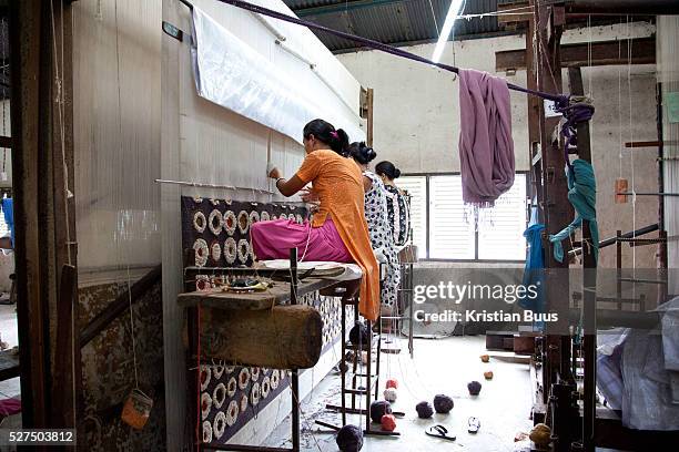 Weavers at Amity Carpent Factory. Amity Factory does not employ children and is a licensee of the GoodWeave Foundation and their carpets carry the...