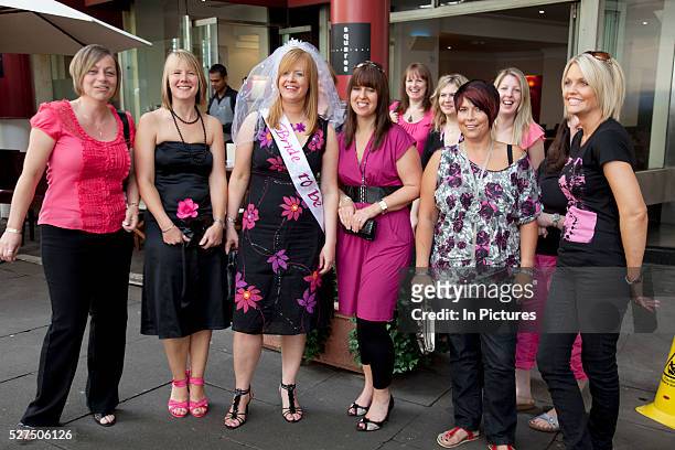 Group of women on a hen party in central London. All dressed up in ink and black the girls are planning a big night ahead.