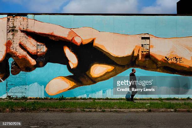 Mural as a homage to Michaelangelo's Sistine Chapel in Rome painted on Grand Boulevard Detroit. Known as the world's traditional automotive center,...