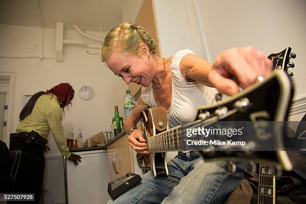 Singer and guitarist Kristin Hersh tuning up her guitar backstage. Throwing Muses at the Islington Assembly Hall, London, UK: Throwing Muses are an...