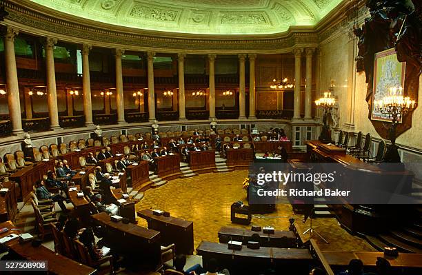 The Portuguese parliament in session from inside the Palacio de Sao Bento in Estrela District, Lisbon. A wide interior view of this semi-circular...