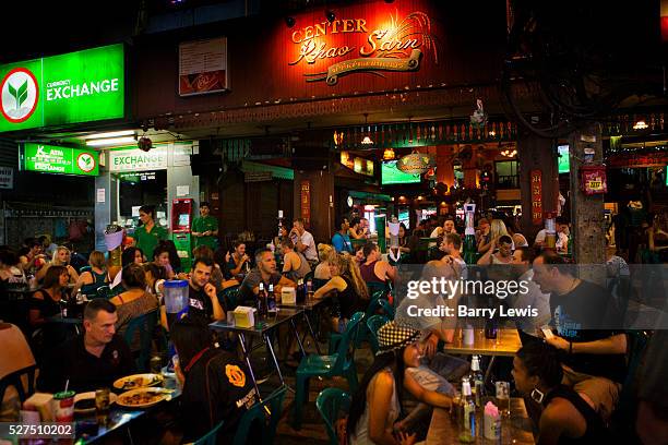 Tourists and visitors drinking at pubs in Khao San Road, Bangkok, Thailand.
