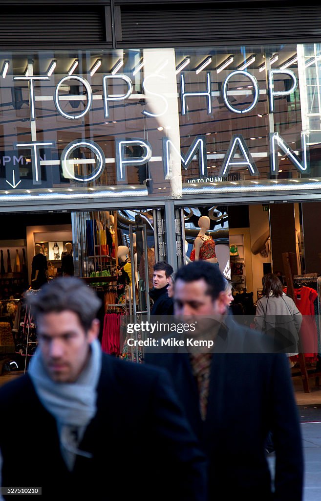 UK - Shopping - Men walking past a Topman / Topshop store