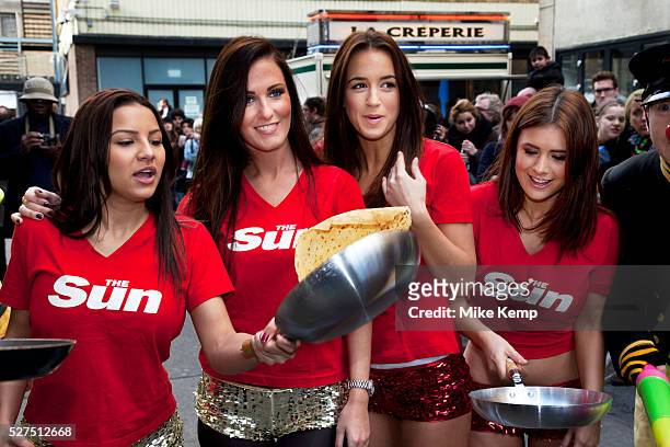 Team from The Sun Newspaper at the Great Spitalfields Pancake Race on Shrove Tuesday, pancake day, at the Old Truman Brewery, London, UK. This is a...