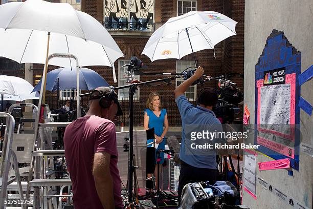 Reporter Natalie Morales with technicians reports live for Today from media village behind railings as tension mounts outside St Mary's Hospital,...