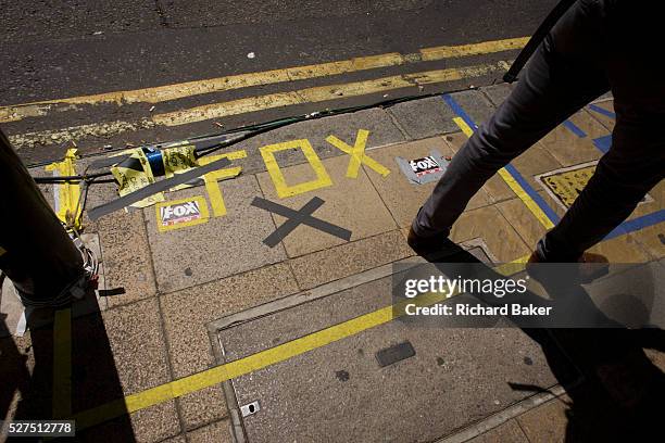 Fox TV markings on pavement as tension mounts outside St Mary's Hospital, Paddington London, where media and royalists await news of Kate, Duchess of...