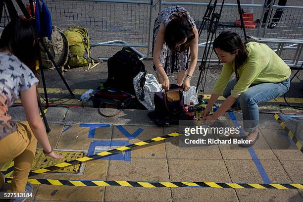 Foreign media mark out tape for their TV broadcasts outside St Mary's Hospital, Paddington London, where media and royalists await news of Kate,...