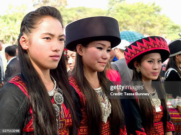 Hmong Der women wearing contemporary Hmong traditional costumes at Ban Km 52 Hmong New Year festival, Vientiane province, Lao PDR. The Hmong...