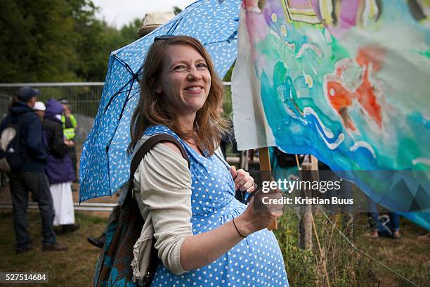 Pregnant woman with a banner next to the Cuadrilla site. Anti-fracking activists join hands to surround the Cuadrilla fracking site. Thousands turned...