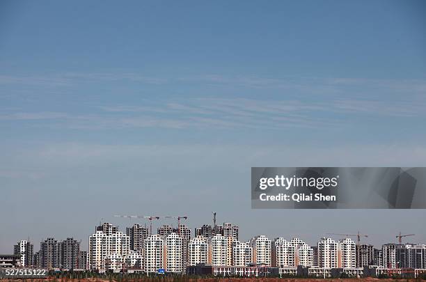 View of densely built residential apartment developments near the Kangbashi New District of Ordos City, Inner Mongolia, China on 16 August, 2011....