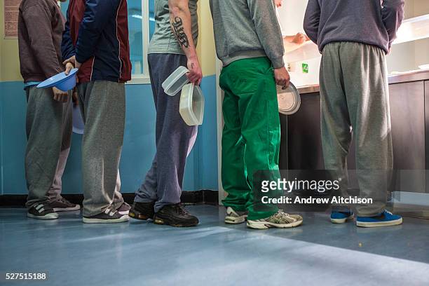 Prisoners line up at the canteen for lunch. Beaufort House, a skill development unit for enhanced prisoners. Part of HMP/YOI Portland, a resettlement...