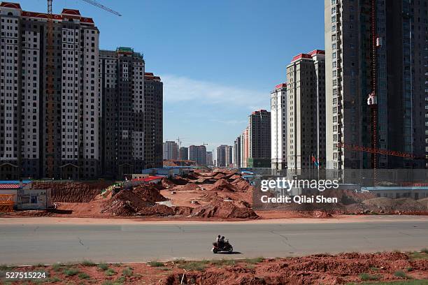View of densely built residential apartment developments near the Kangbashi New District of Ordos City, Inner Mongolia, China on 16 August, 2011....