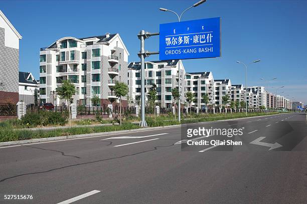 New apartments line an otherwise empty street in Kangbashi New District of Ordos City, Inner Mongolia, China on 16 August, 2011. With an investment...