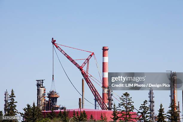 crane used for new equipment installation at an oil refinery - edmonton industrial stock pictures, royalty-free photos & images