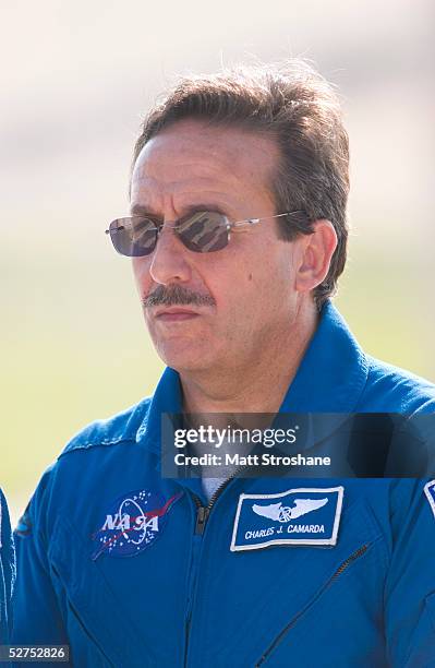 Space Shuttle Discovery mission specialist Charles Camarda of Queens, New York addresses the media in front of the shuttle on launch pad 39B at the...