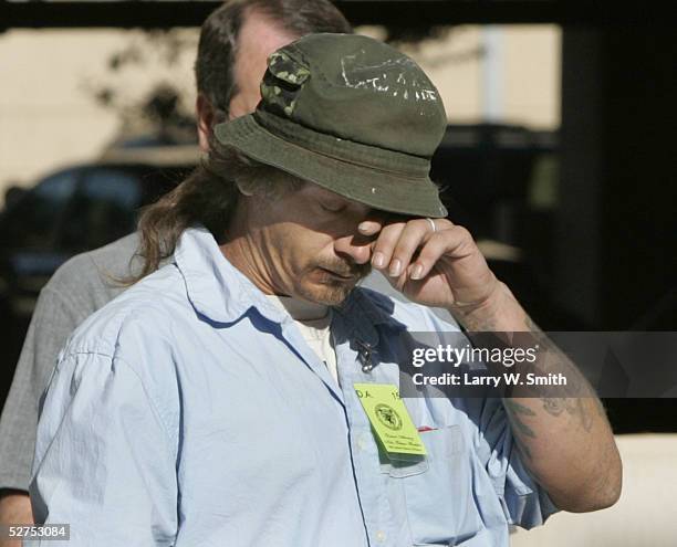 Steven Relford wipes his eyes as he leaves the Sedgwick County Courthouse on the day of Dennis L. Raders second appearance in court May 3, 2005 in...