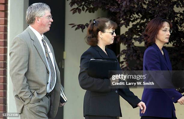 The defense team for accused serial killer Dennis Rader Steve Osburn, Jama Mitchell and Sarah McKinnon walk to the Sedgwick County Courthouse on the...