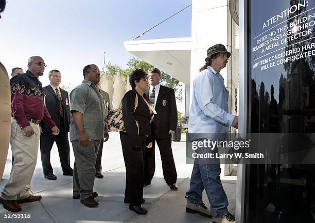 Steven Relford, Carmen Montoya, Daniel Otero and Charlie Otero walk into the Sedgwick County Courthouse on the day of Dennis L. Raders second...