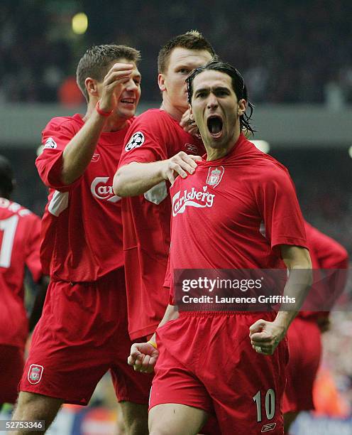 Luis Garcia of Liverpool celebrates scoring the opening goal with John Arne Riise and Steve Gerrard during the UEFA Champions League semi-final...