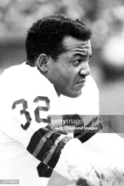Runningback Jim Brown of the Cleveland Browns, on the bench during a game in 1964 at Municipal Stadium in Cleveland, Ohio.