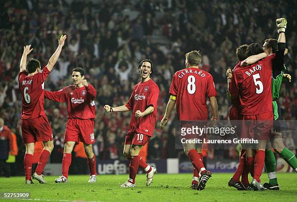 Liverpool players celebrate at the end of the UEFA Champions League semi-final second leg match between Liverpool and Chelsea at Anfield on May 3,...