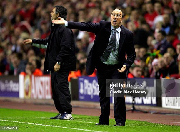 Jose Mourinho the manager of Chelsea and Rafael Benitez the manager of Liverpool shout instructions to their players during the Champions League semi...