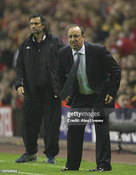 Jose Mourinho the manager of Chelsea and Rafael Benitez the manager of Liverpool shout instructions to their players during the Champions League semi...