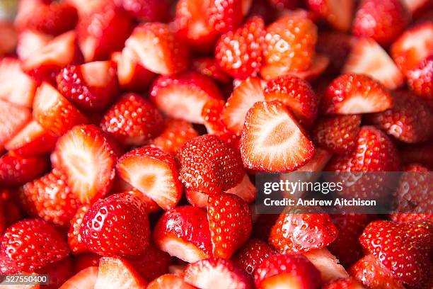 Freshly cut garden strawberries ready to eat at a summer party.