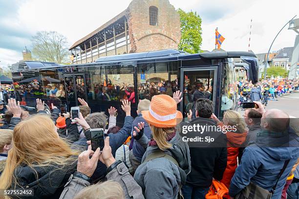 king willem alexander and queen maxima in the royal bus - koningsdag stockfoto's en -beelden