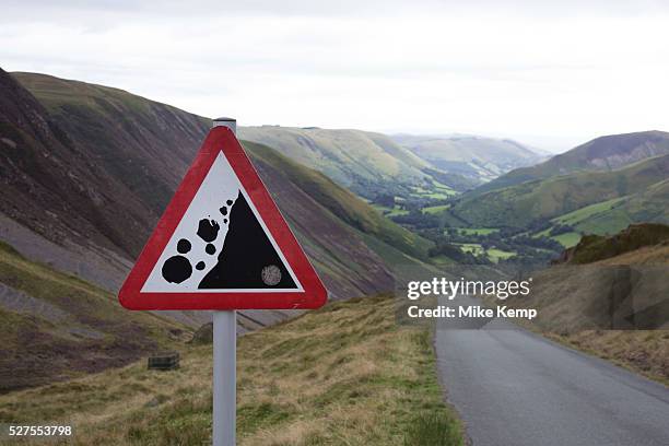 View along a valley in the Cambrian Mountains from a point of natural beauty towards Llanymawddwy. Wales, UK. A warning sign showing that there may...