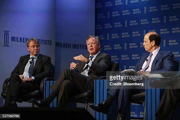 Brian France, chairman and chief executive officer of NASCAR, center, speaks as Wesley Edens, founder and co-chairman of Fortress Investment Group...