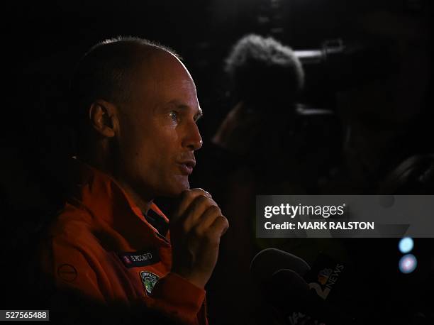Swiss pilot Bertrand Piccard is interviewed after alternate pilot Andre Borschberg successfully landed the Solar Impulse 2 at the Phoenix Goodyear...