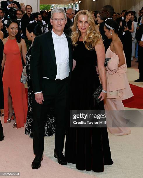 Apple CEO Tim Cook and Laurene Powell-Jobs, widow of Steve Jobs, attend "Manus x Machina: Fashion in an Age of Technology", the 2016 Costume...