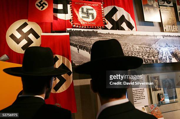 Ultra-Orthodox Jews look at an exhibit on Adolph Hitler and the Nazi rise to power in the Yad Vashem Holocaust Memorial museum May 4, 2005 in...