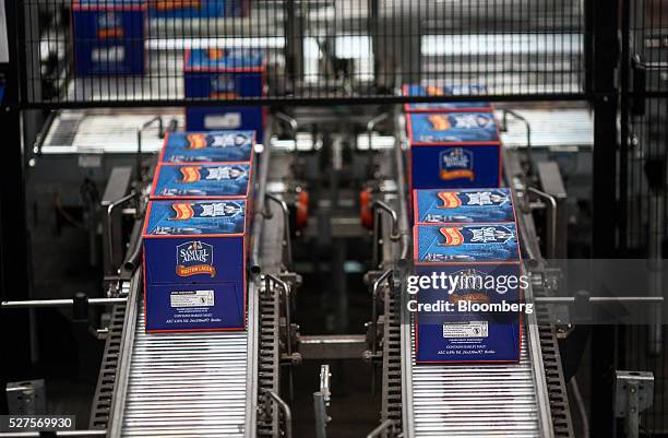 Boxes of Boston Lager make their way along the production line in the bottling house at the Shepherd Neame Plc brewery in Faversham, U.K., on Friday,...