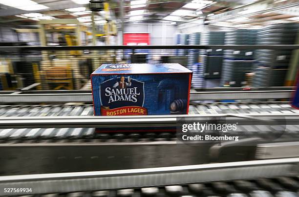 Box of Samuel Adams Boston Lager travels along the production line in the bottling house at the Shepherd Neame Plc brewery in Faversham, U.K., on...