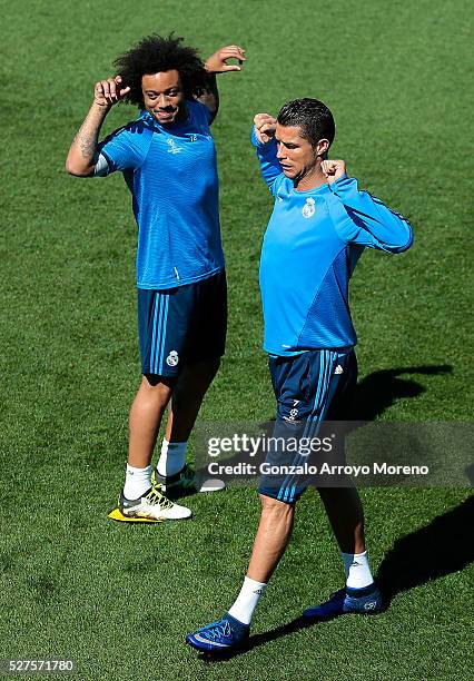 Cristiano Ronaldo of Real Madrid and Marcelo of Real Madrid stretch during a training session ahead of the UEFA Champions League Semi Final Second...