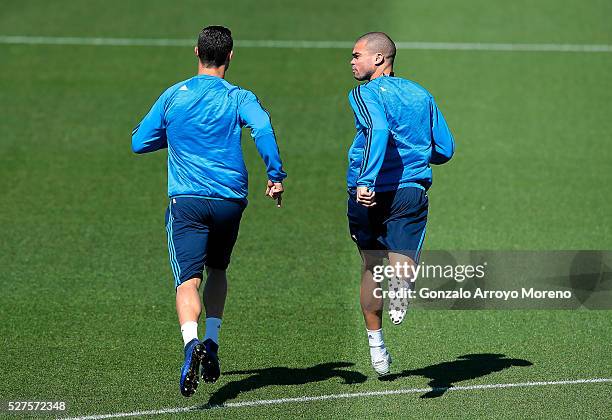 Cristiano Ronaldo of Real Madrid and Pepe of Real Madrid warm up during a training session ahead of the UEFA Champions League Semi Final Second Leg...