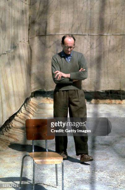 Nazi war criminal Adolf Eichmann paces in the yard at Ramle Prison, central Israel, ten days before the start of his trial, 1st April 1961.