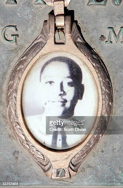 Photo of Emmett Till is included on the plaque that marks his gravesite at Burr Oak Cemetery May 4, 2005 in Aslip, Illinois. The FBI is considering...