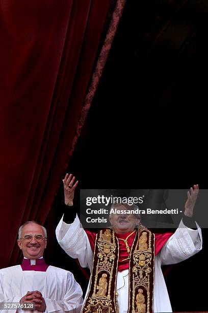 Pope Benedict XVI salutes Catholic faithfuls from the balcony of St. Peter's Basilica shortly after being elected as new Pope by the College of...