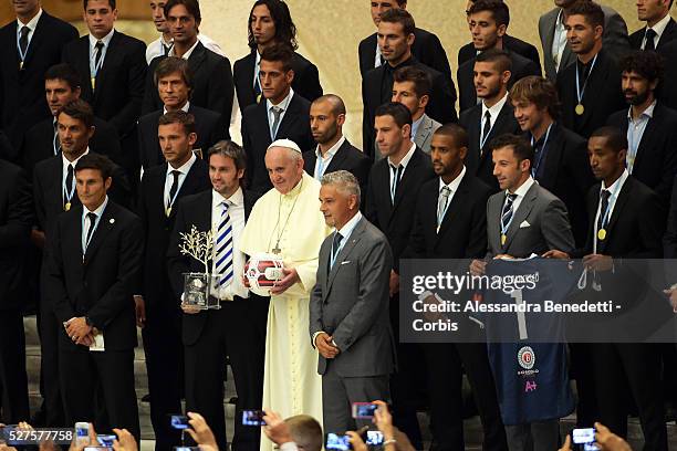 Pope Francis takes a family photo with the players of the 'Partita Interreligiosa Della Pace' at Paul VI Hall on September 1, 2014 in Vatican City,...