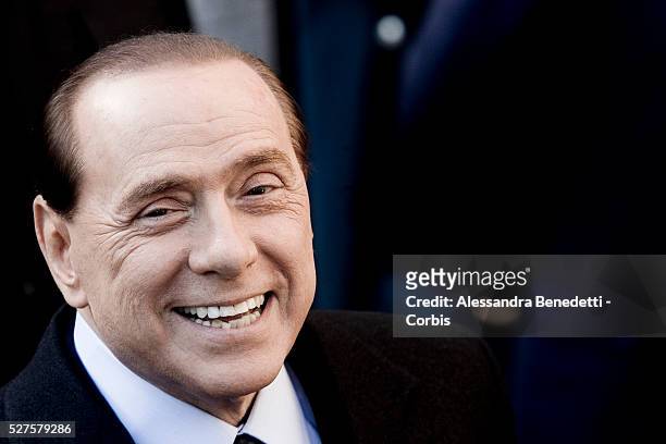 Italy's Prime Minister Silvio Berlusconi smiles as he arrives at Villa Madama to attend a meeting with british Prime Minister Grodon Brown at Villa...