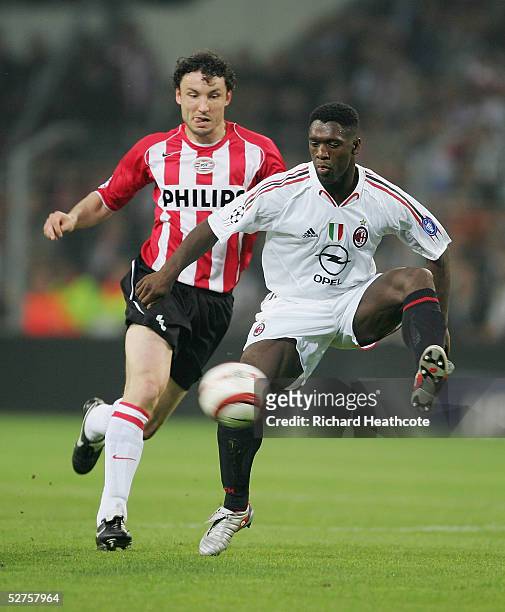 Clarence Seedorf of Milan controls the ball under pressure from Mark Van Bommel of PSV during the UEFA Champions League Semi Final, 2nd Leg, match...