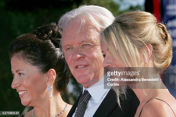 British actor Antony Hopkins poses for photographers with his wife and daughter during the official presentation of movie "Proof" directed by John...